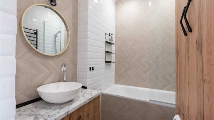 Add Warmth and Texture to Your Grey Bathroom Elevate Your Design with Cream Brick Contrasting Tiles.
