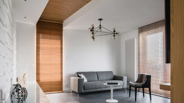 Create a Tranquil Oasis with Sophisticated Style Explore the Beauty of White Wooden Venetian Blinds in the Bedroom.