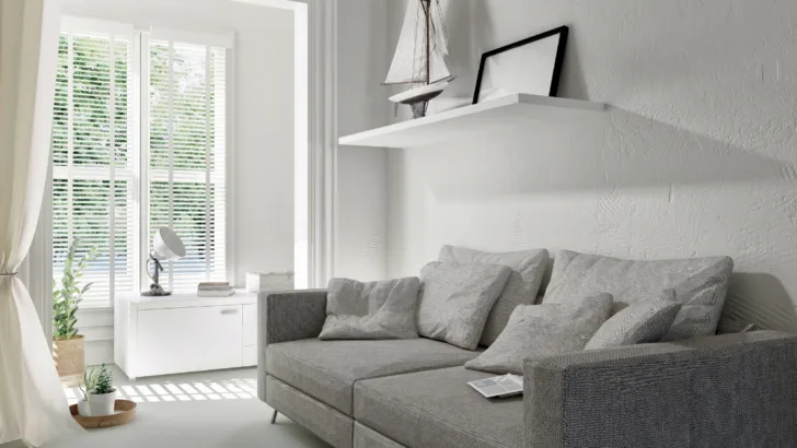Elevate your living room with the perfect balance of sophistication and comfort - the classic combination of beige carpet and a sleek grey sofa. 