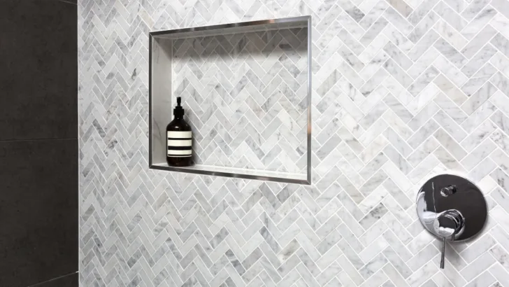 Make a Statement with a Striking Contrast Elevate Your Bathroom Design with Grey Tiles and Crisp White Grout. 